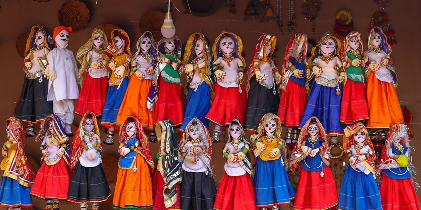 Dolls in traditional wear at Prachin Museum, Bikaner, showcasing ancient art and history.