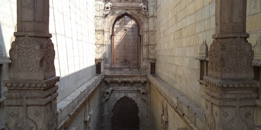 Intricately carved pillars seen inside Raniji ki Baori.