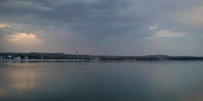An image view of Sagar Lake at sunset, showcasing surrounding greenery, being one of the top things to do in Sagar.