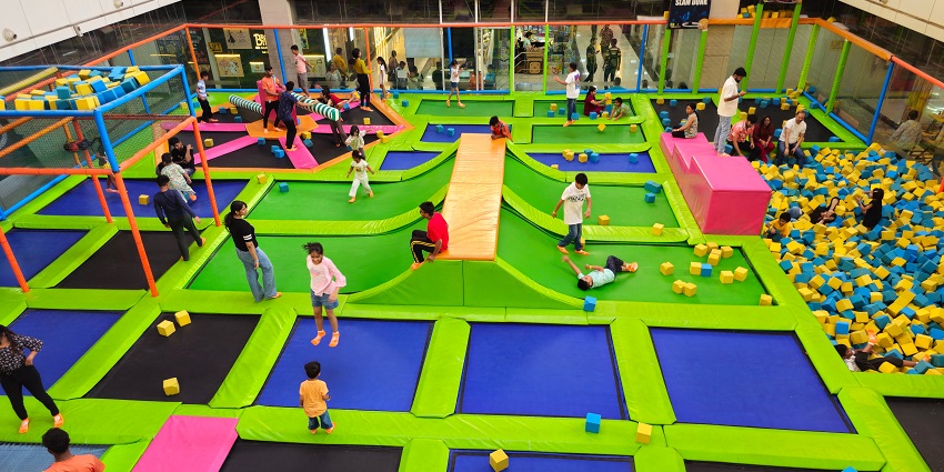 Top view of people bouncing around on the trampolines and having fun