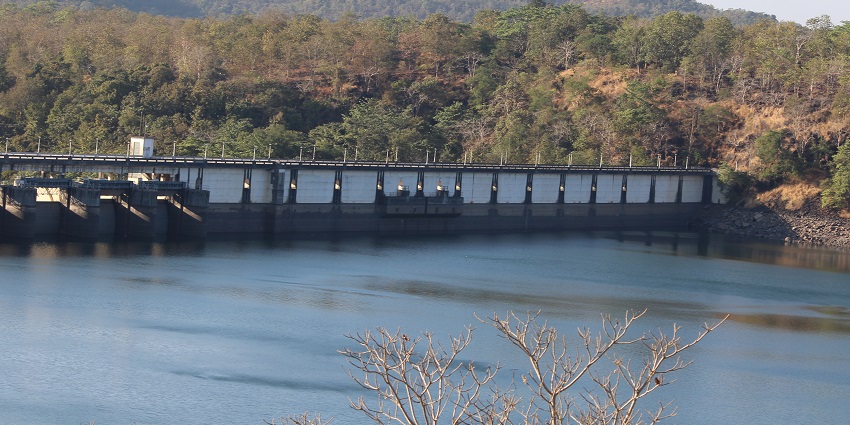 A stunning scenic view of dam near Lonavala, Mumbai, with lush greenery and calm waters.