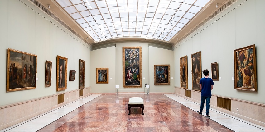 Inside the halls of the gallery showcasing a mix of traditional and contemporary paintings