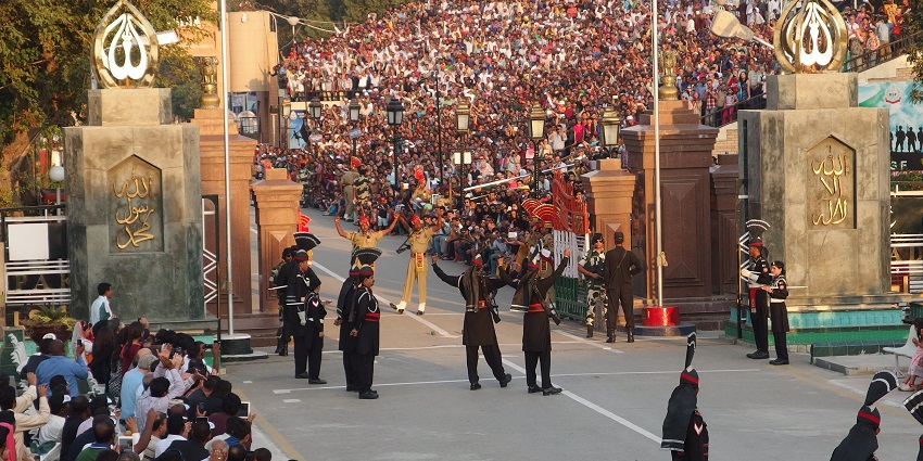 A crowd of people at the Wagah Border, one of the best places to visit in Amritsar.