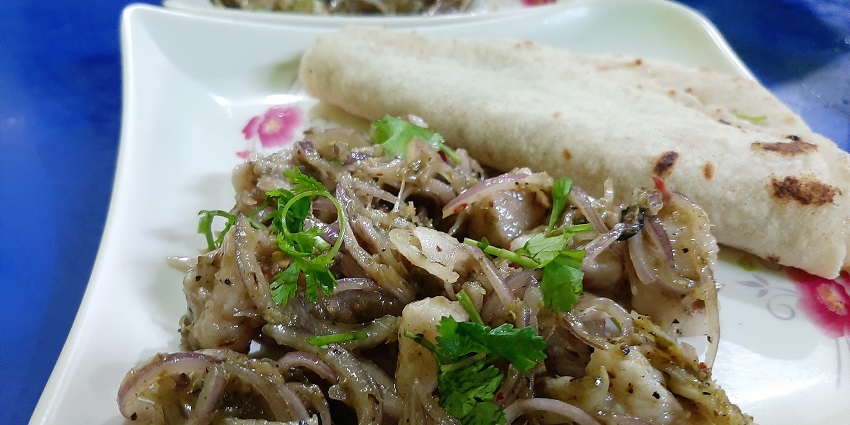 Image of a traditional dish of Tripura Wahan Mosdeng served on a plate during the Harvest Festival of Tripura