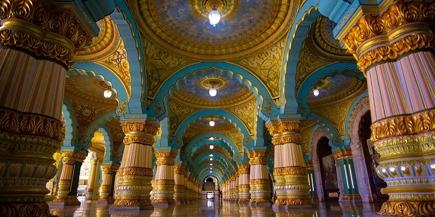 The blue and gold interiors on the walls and the pillars of the Palace situated in India