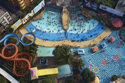 The water park in Ahmedabad consists of a wave pool and multiple water slides.