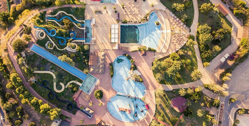 An aerial view of a tourist attraction in the region decked with thrilling water rides.