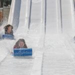 An image of a vibrant water park in Indore showcasing various slides and pools.