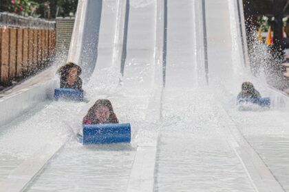 An image of a vibrant water park in Indore showcasing various slides and pools.