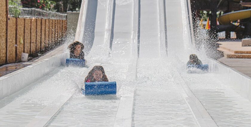 An image of a vibrant water park in Indore showcasing various slides and pools.