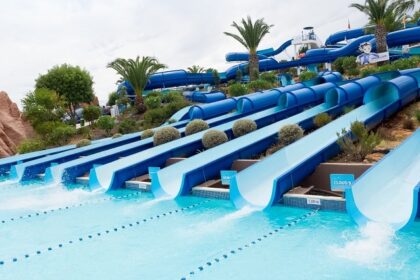 A bunch of water slides at a water park to seek thrill and a fun day full of adventure.