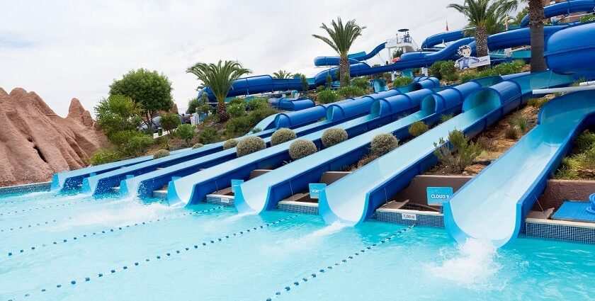 A bunch of water slides at a water park to seek thrill and a fun day full of adventure.