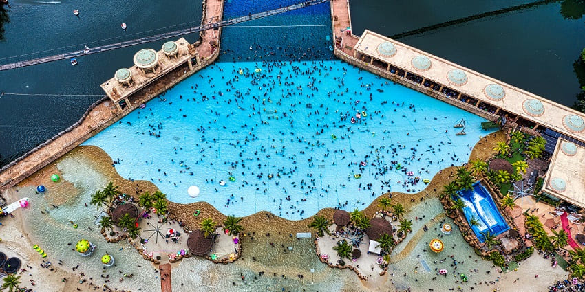 An aerial view of the raj water park and report with its huge swimming pool visible