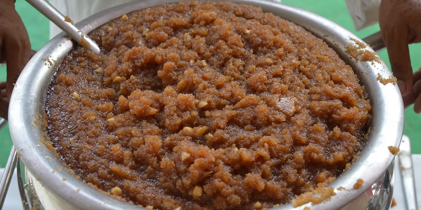 Close-up of a serving of Halwa, a sweet dessert, highlighting its texture and presentation.