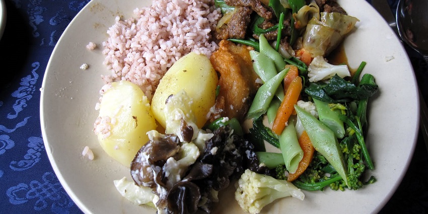 A variety of traditional Bhutanese dishes, showcasing the rich culinary heritage of the region.