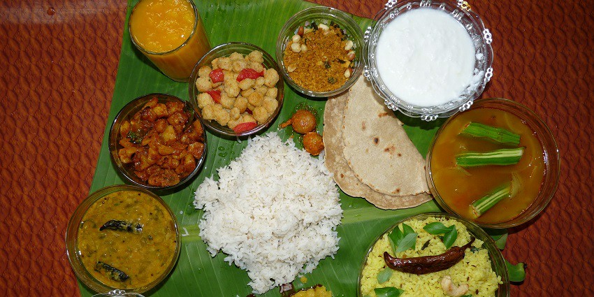 Traditional Andhra combo meal with a variety of colorful dishes served on a banana leaf