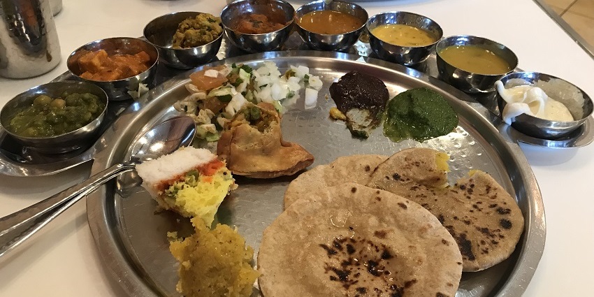 You can enjoy a delish vegetarian thali in a restaurant near the historic Surat Fort.