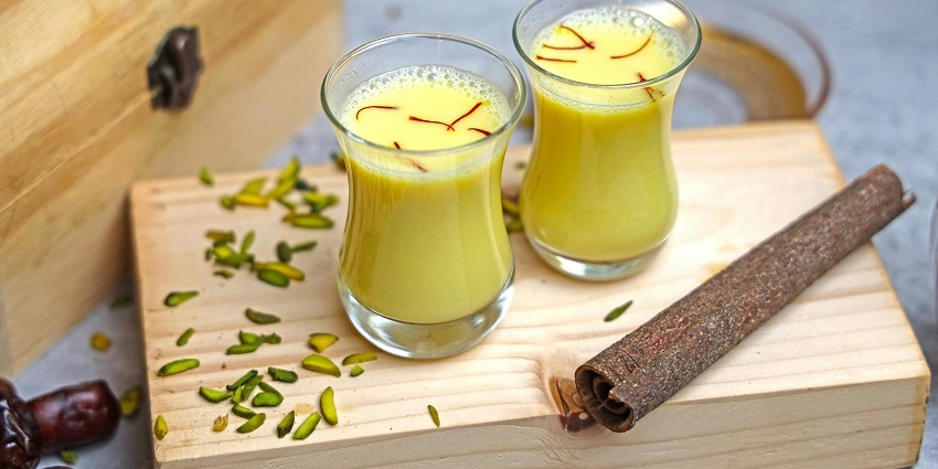 Two glasses of milk with cinnamon and nuts, a cold dessert offering in various facilities.