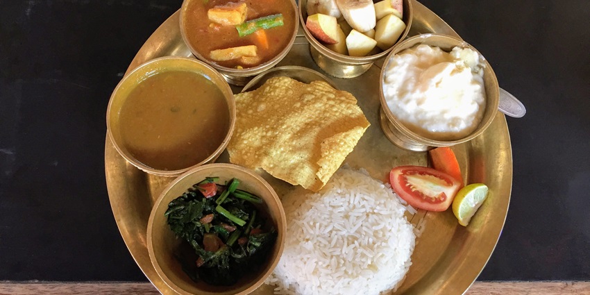 An assorted meal of Nepali dal-bhat-tarkari which you can enjoy at a restaurant here