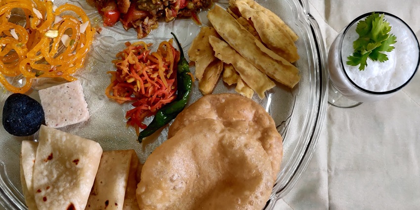 Homemade Gujarati Undhiyu served with vibrant vegetables, a specialty near Shanku Water Park, Mehsana.