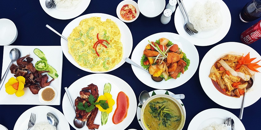 Snapshot of the buffet of cambodian cuisines being served on the ceramic plates