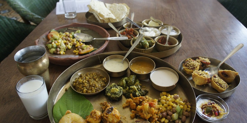 Snap of the mouthwatering Gujarati thali includes traditional Gujarati dishes, sweets and snacks