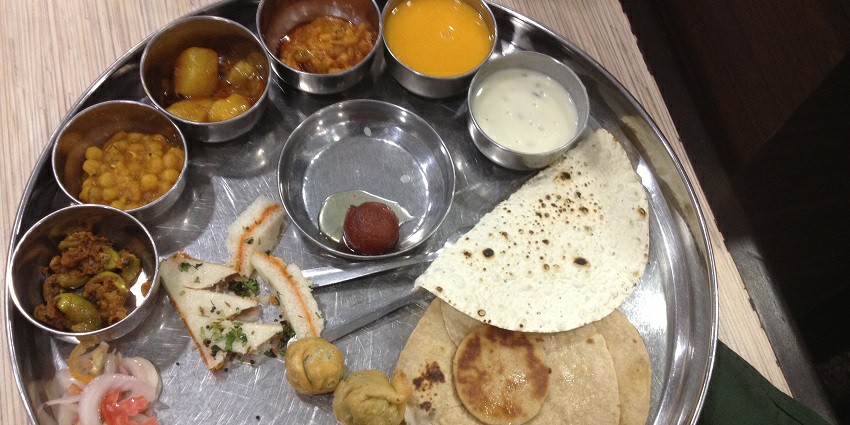 A sneak peek of the Gujarati Thali which is the traditional way to serve the food in Gujarat