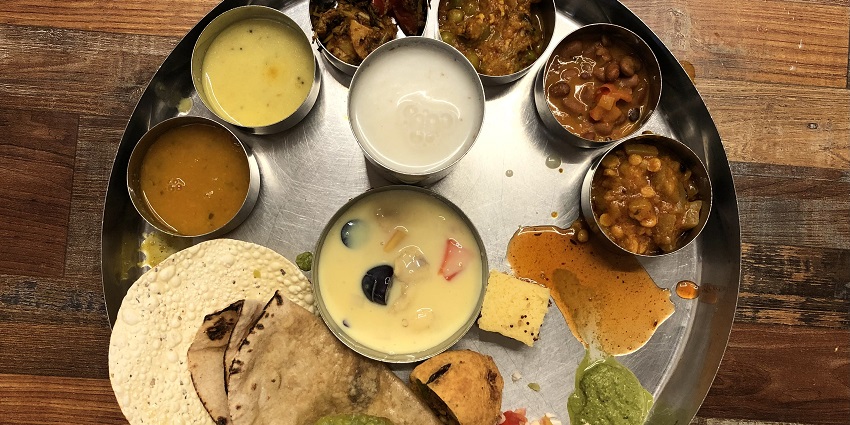 A delicious and gourmet veg thali.