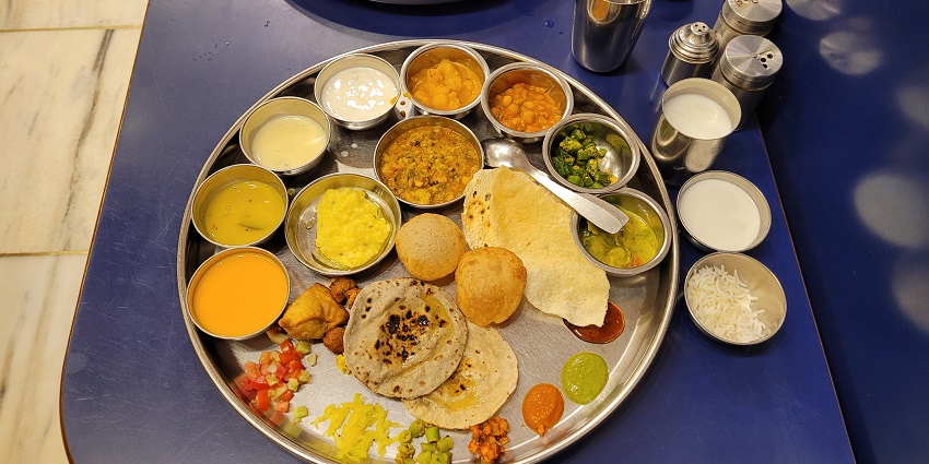 The Gujarati thali includes variety of dishes.
