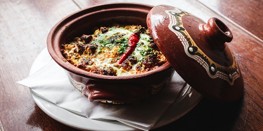 Savour the delicious dishes on your visit to the National Crafts Museum, New Delhi, India.