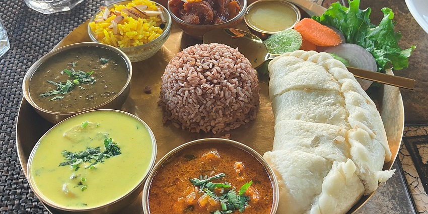 Himachali dish “Siduu” displayed on a plate, featuring traditional preparation and garnishes