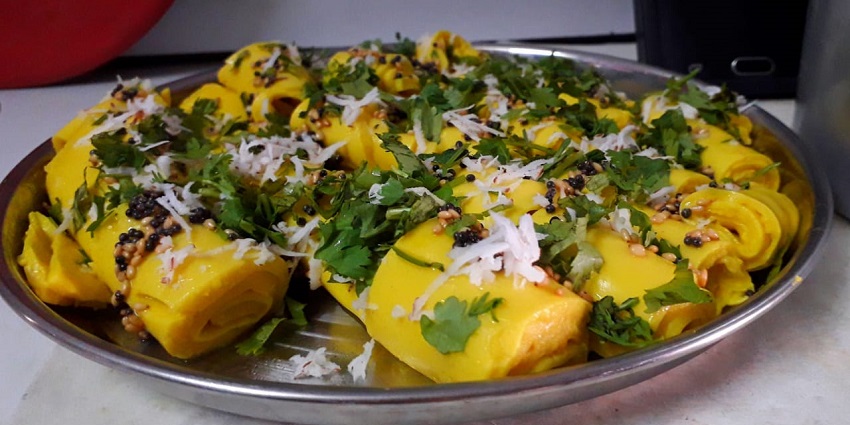Snack made from Gram Flour and Tangy Butter Milk. Both are mixed, cooked and rolled in to round wraps