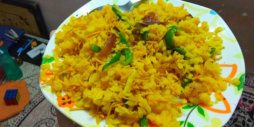 An image of Poha, a dish quite popular in India that is made by flaky rice cooked with vegetables and spices.