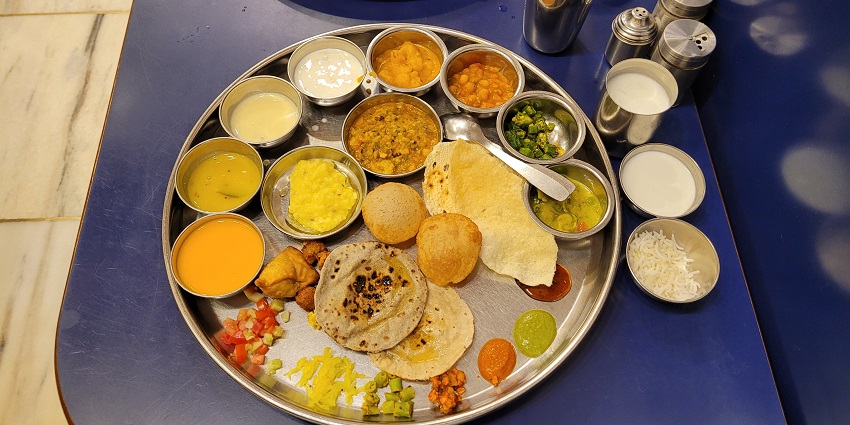 A large plate filled with an assortment of food items.