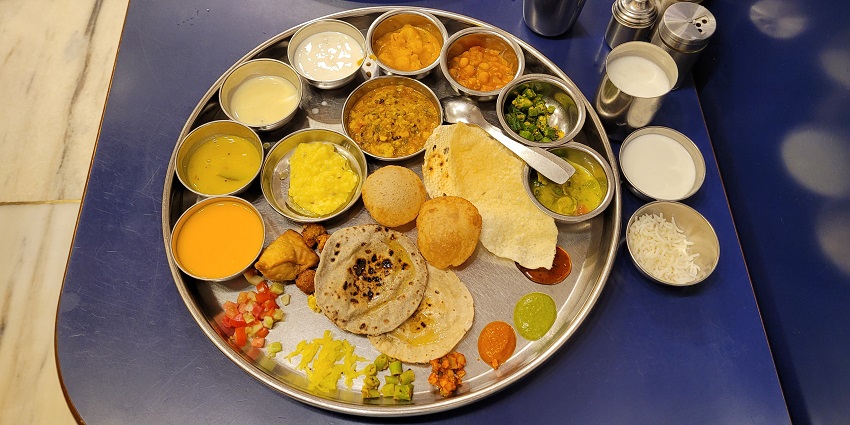 The Gujarati thali includes variety of dishes.