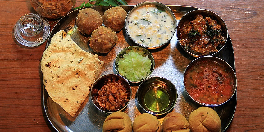 The various delicacies in Rajasthani Thali are a must-have for travellers to Amer Fort.