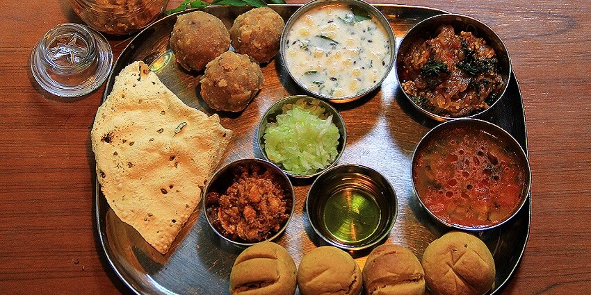 Rajasthani snacks and cuisine like Daal Baati Churma are a must-try for visitors.