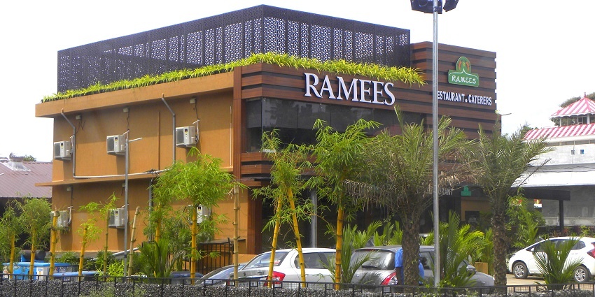 A picture of a restaurant in Kerala taken from across the street
