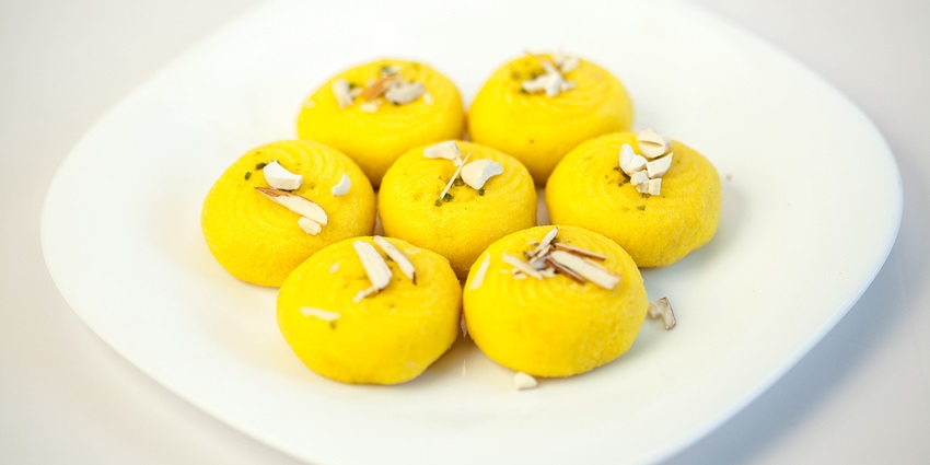 Yellow pedas on a white plate, a speciality of Jharkhand that you must try