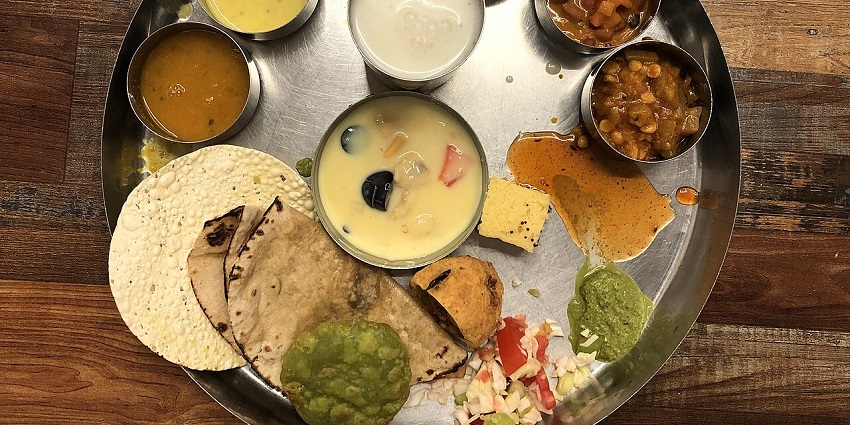 table filled with an enticing array of Rajasthani food.