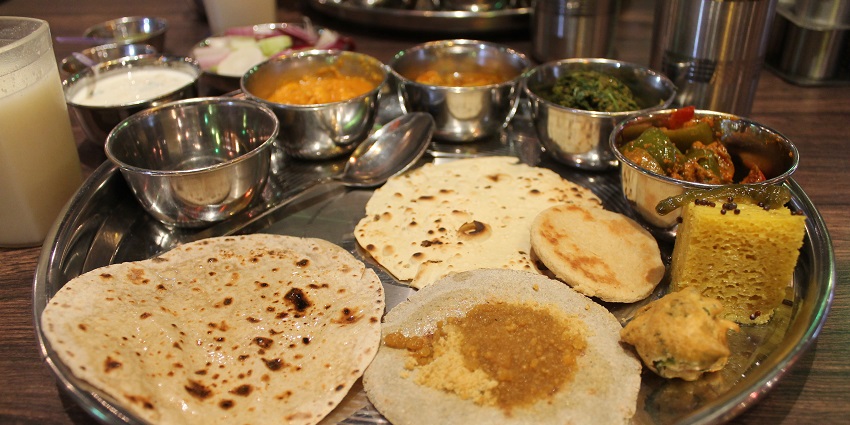 A Rajasthani thali near Sariska National Park, offering a variety of local delicacies.