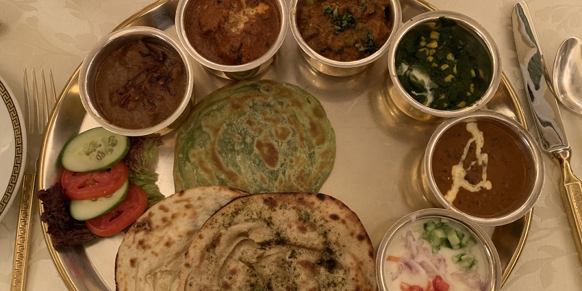 Royal Rajasthani thali featuring an assortment of traditional Rajasthani dishes.