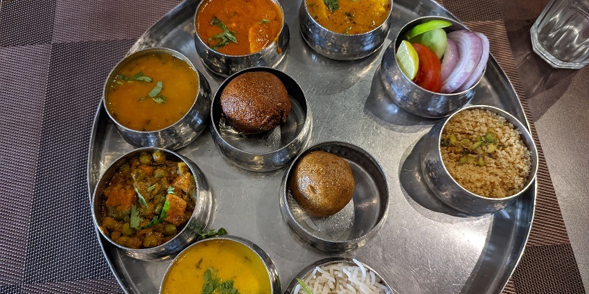 Enjoy Rajasthani dishes at Laxmi Misthan Bhandar, Suvarna Mahal, or street food.
