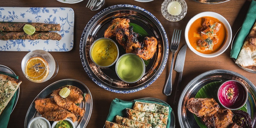 Snap of the mouth-watering multiple platter of dishes on the table in the restaurant in Chandigarh