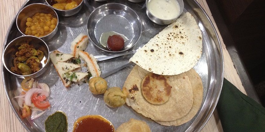 A plate of Gujarati food, a popular Gujarati dish for travellers to taste in Rajkot.