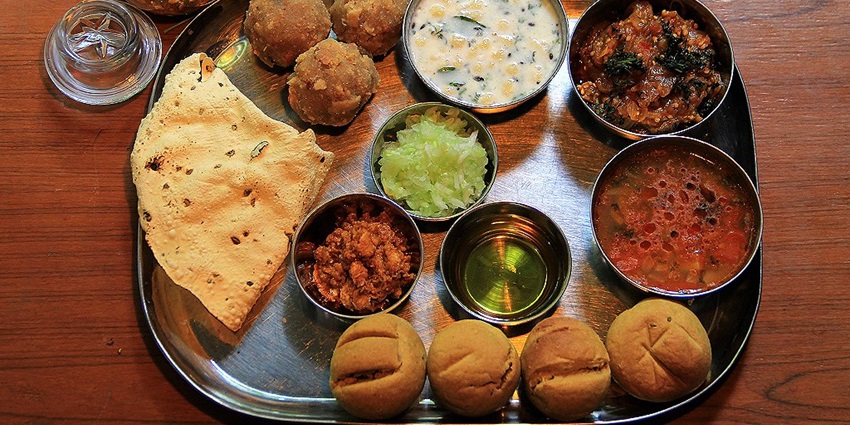 Mouthwatering snapshot of the traditional Rajasthani thali having varieties of Food items