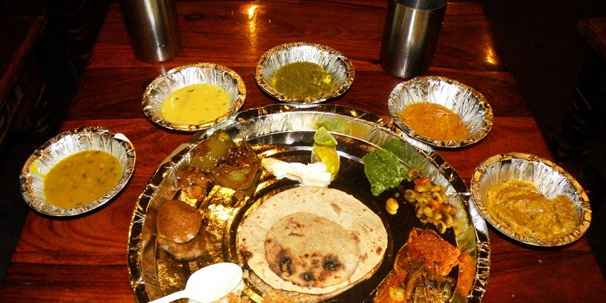Rajasthani thali, offering local delicacies in restaurants near Gajner Wildlife Sanctuary.