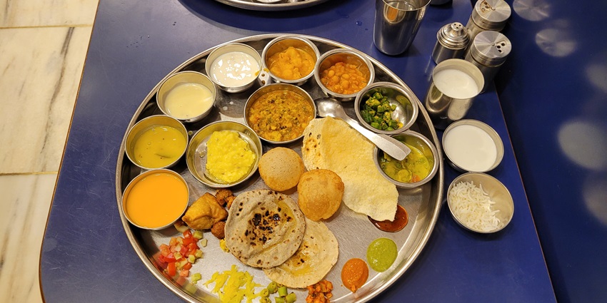 The Gujarati thali includes a variety of dishes.