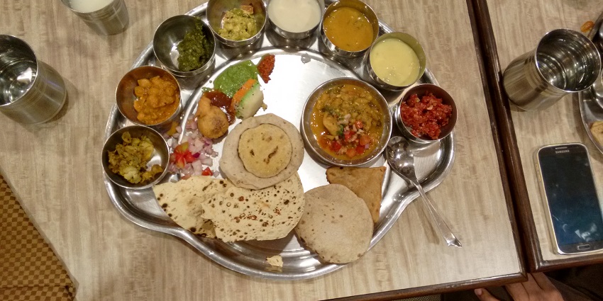 A traditional thaali near Pashupatinath Temple filled with various dishes and condiments.