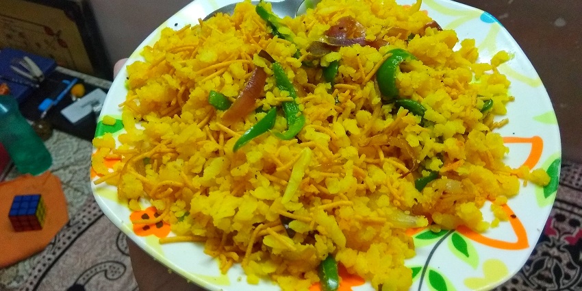 Try Poha, a flaked rice snack loved and cherished in Indore.